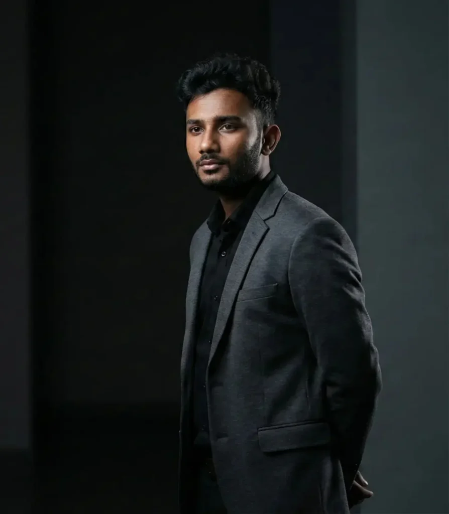 Vidhu Vinodhanan standing in a professional setting as an SEO expert in Kochi