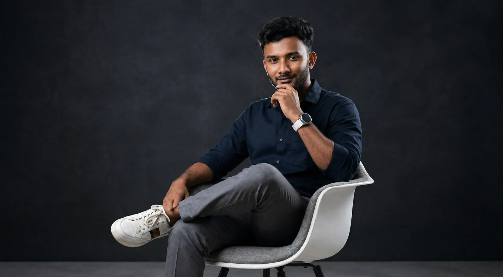 SEO strategist Vidhu Vinodhanan seated in a modern professional workspace